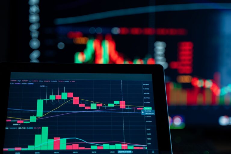 Beginner learning how to read a stock chart with labelled price, volume, and trend line on a computer screen