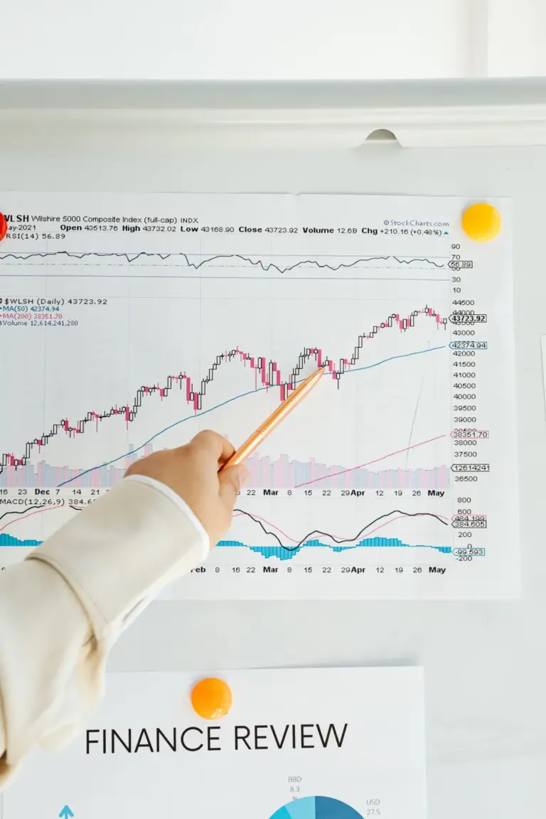 A beginner investor reviewing what is an index fund on a tablet, with a chart showing the historical growth of an S&P 500 index fund.